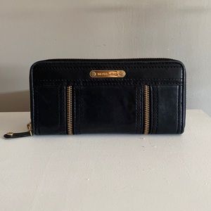 Michael Kors wallet. Leather with gold detailing.